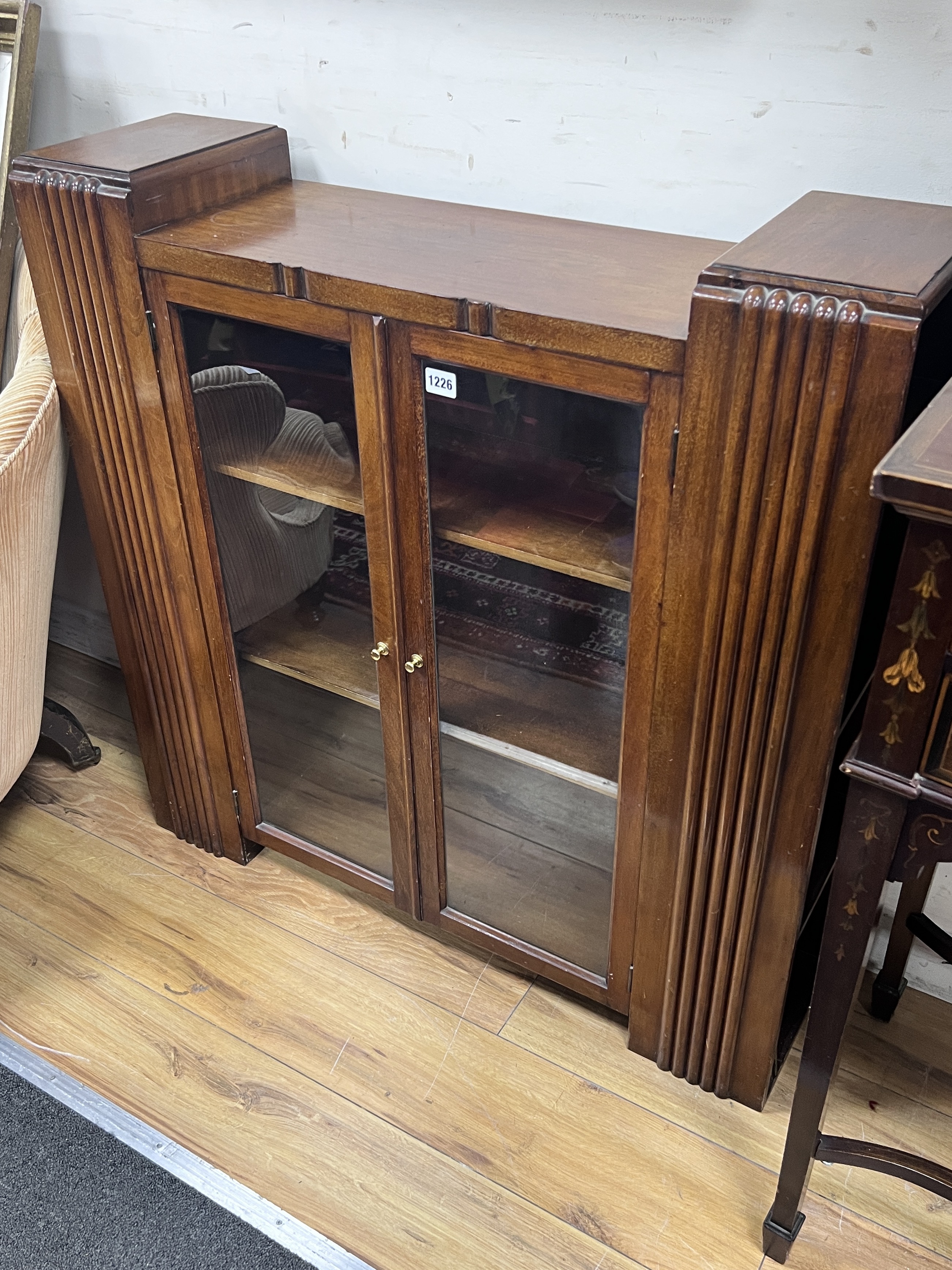 An Art Deco glazed walnut bookcase, width 90cm, depth 25cm, height 91cm